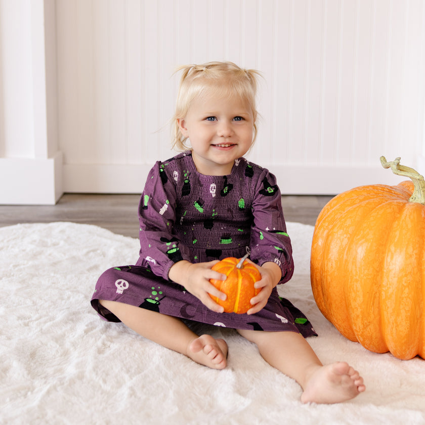 Long Sleeve Smocked Dress in Hocus Pocus